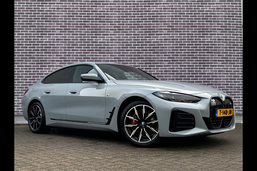 BMW i4 eDrive40 High Executive 84 kWh / SoH 93,5% / Trekhaak / 360Camera / Head-up / Leder / 19'' / Navigatie / Stoelverwarming / DAB / Cruise Control