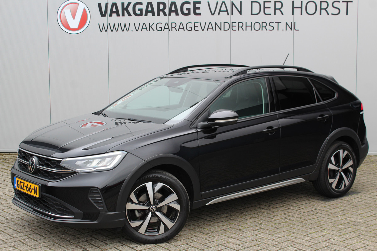 Volkswagen Taigo 1.0-96pk TSI Oranje Edition. Zeer nette en luxe hoogzitter, slechts 33.500km ! Airco, cruise cntrl adaptief, camera, pdc achter, trekhaak, LED verlichting, Apple Carplay/Android auto, bluetooth telefoonvoorb., digitaal dashboard etc.