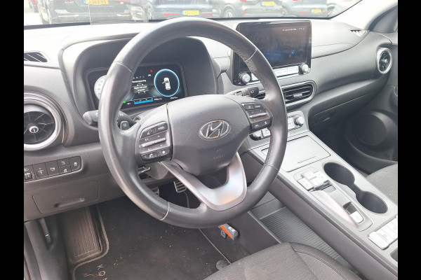 Hyundai Kona EV Fashion 64 kWh | SOH: 94,5% | 3 Fase | Warmtepomp | Blindspot | Navi | Camera |