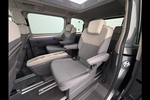 Volkswagen Multivan Bulli 218PK eHybrid AUT-6 Pano-Dak Navi 3-Zone Ecc Cruise Control Camera Trekhaak Apple Carplay Android Pdc Stoelverwarming Life 2+2+2 Premium Zitopstelling Keyless Lmv 19" Easy Open Pack Privacy Glas Elek.Achterklep Led Origineel Nederlandse Bus Dealeronderhouden 1.600kg trekvermogen