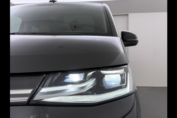 Volkswagen Multivan Bulli 218PK eHybrid AUT-6 Pano-Dak Navi 3-Zone Ecc Cruise Control Camera Trekhaak Apple Carplay Android Pdc Stoelverwarming Life 2+2+2 Premium Zitopstelling Keyless Lmv 19" Easy Open Pack Privacy Glas Elek.Achterklep Led Origineel Nederlandse Bus Dealeronderhouden 1.600kg trekvermogen