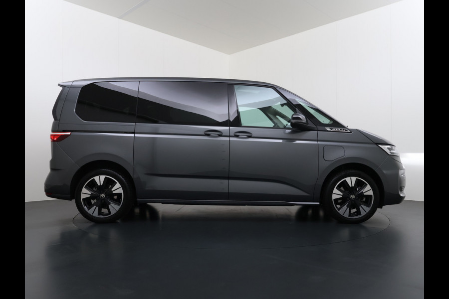 Volkswagen Multivan Bulli 218PK eHybrid AUT-6 Pano-Dak Navi 3-Zone Ecc Cruise Control Camera Trekhaak Apple Carplay Android Pdc Stoelverwarming Life 2+2+2 Premium Zitopstelling Keyless Lmv 19" Easy Open Pack Privacy Glas Elek.Achterklep Led Origineel Nederlandse Bus Dealeronderhouden 1.600kg trekvermogen