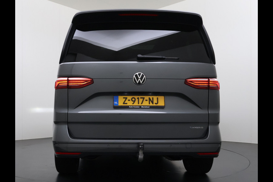 Volkswagen Multivan Bulli 218PK eHybrid AUT-6 Pano-Dak Navi 3-Zone Ecc Cruise Control Camera Trekhaak Apple Carplay Android Pdc Stoelverwarming Life 2+2+2 Premium Zitopstelling Keyless Lmv 19" Easy Open Pack Privacy Glas Elek.Achterklep Led Origineel Nederlandse Bus Dealeronderhouden 1.600kg trekvermogen