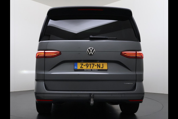 Volkswagen Multivan Bulli 218PK eHybrid AUT-6 Pano-Dak Navi 3-Zone Ecc Cruise Control Camera Trekhaak Apple Carplay Android Pdc Stoelverwarming Life 2+2+2 Premium Zitopstelling Keyless Lmv 19" Easy Open Pack Privacy Glas Elek.Achterklep Led Origineel Nederlandse Bus Dealeronderhouden 1.600kg trekvermogen