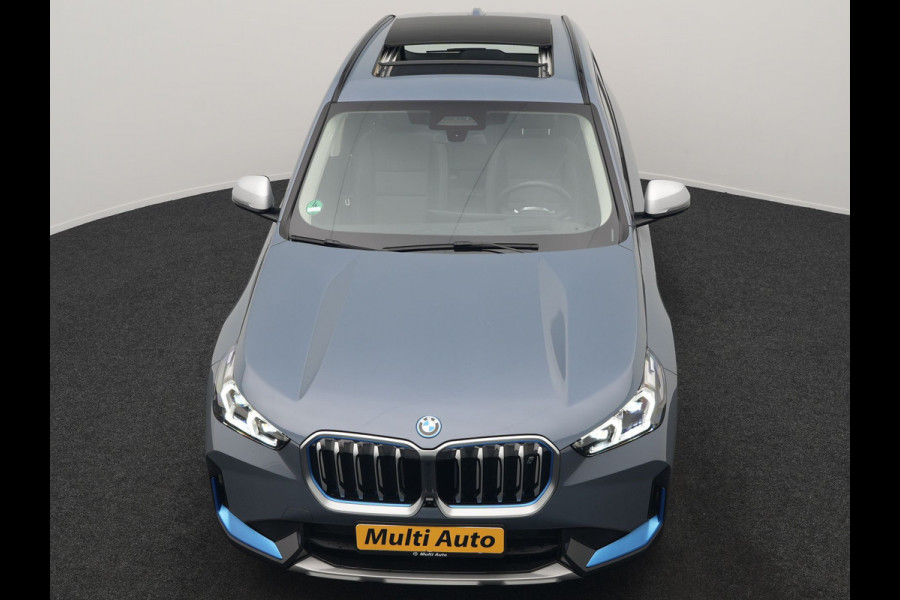 BMW iX1 xDrive30 Launch Edition 313pk Dealer O.H | Panodak | Adaptive Cruise | 360 Camera | Lederen Comfortzetels Massage & Memory | Head Up | Harman Kardon | Keyless |