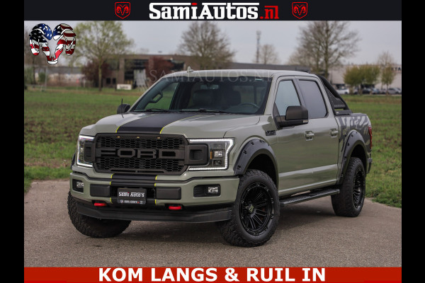 Ford USA F-150 5.0 V8 4X4 | MAT OLIVE GREEN | BIJTELLING VRIJ | ZEER DIK | CAMERA | 3500KG | PANORAMA | LEDER | GO RHINO ROLLBAR | CRUISE CONTROL | PRINS LPG | BAKFLIP COVER | Deze pick-up is leverbaar met zowel een groot rijbewijs (C) als een klein rijbewijs (B). Laat ons weten wat jouw voorkeur is.