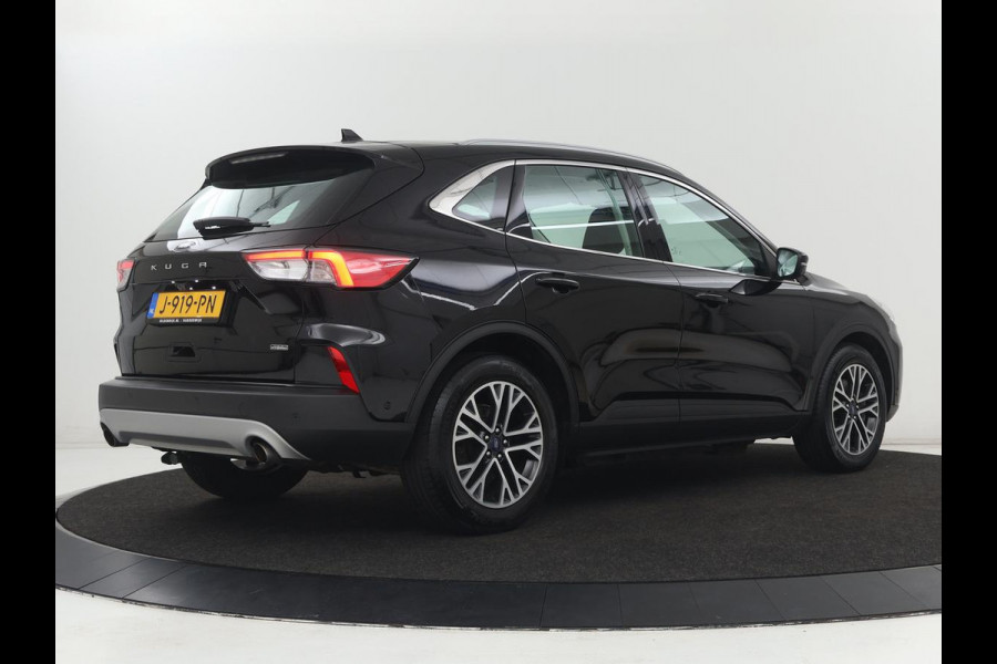 Ford Kuga 2.5 PHEV Titanium | SOH 91,5% | Trekhaak | Stoelverwarming | Adaptive cruise | Camera | Caplay | Navigatie | Dodehoek detectie | Keyless | Digital Cockpit | Achterbankverwarming | Plug In
