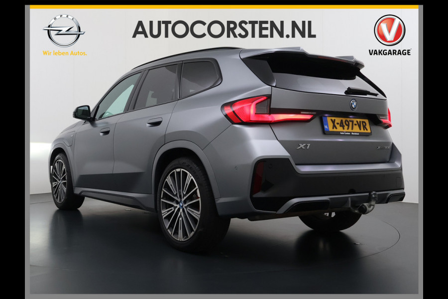 BMW X1 xDrive30e 327pk M-sport Leer Pano-Dak/Hef-Dak M-Sportstoelen+Elektr.+Geheugen+Verwarmd Trekhaak Harman-Kardon Adaptive-LED Live- Adaptive-Cruise AWD StuurVerwarmd Zwarte-Hemel Travelpack Park-Assist Pdc Draadloze lader Innovations-pakket Comfort-Pack €75.000,- Nieuw  Orig.NL auto! 1.800kg trekvermogen