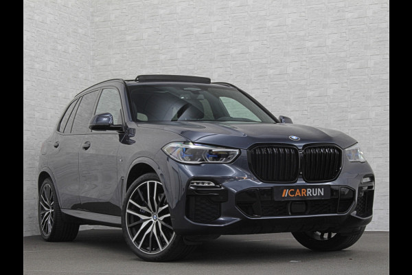 BMW X5 xDrive40i M-Sport | Panorama | 360 Camera | ACC | Laser-LED | Head-Up | Harman-Kardon | Trekhaak | Keyless-Entry | 22 inch | Memory | Leder | Carplay | Dealer Onderhouden | ISO-Glas | Sfeerverlichting | Draadloos Laden |