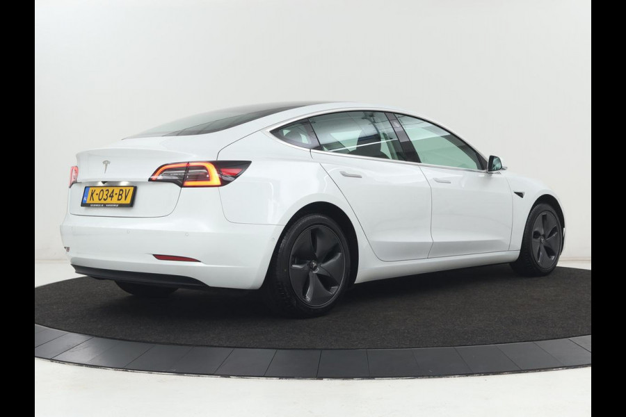 Tesla Model 3 Standard RWD Plus 60 kWh | SOH 87,7% | Autopilot | Trekhaak | Panoramadak | Leder | Stoelverwarming | Full LED | Camera | Navigatie | Keyless
