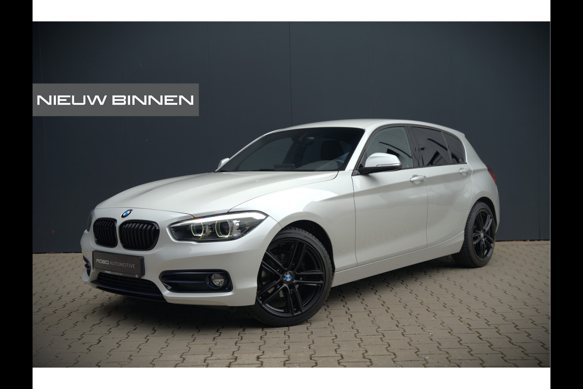 BMW 1-serie 118i Sport Line Edition | Stoelverwarming | Cruise Control | Parkeersensoren | Navigatie | Groot Scherm | Digitale Tellers | Automaat | Keyless | Trekhaak | LED