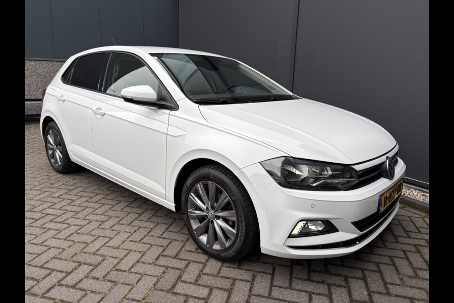 Volkswagen Polo 1.0 TSI Highline Airco - Apple carplay - Navigatie - Parkeersensoren - Parkeer assistent - Cruise control - Licht metalen velgen 16 inch - Lederen versnellingspook - Bluetooth - Led verlichting - Radio - Start/stop systeem - Stuur leder - Stuur multifunctioneel - Elektrische ramen