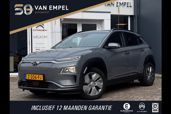 Hyundai Kona EV Comfort Smart 39 kWh | 100% SOH | Trekhaak | Camera | Stoel + Stuurverwarming | Navigatie