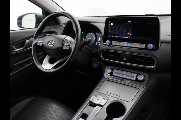 Hyundai Kona EV PREMIUM SKY 64 kWh 100% SOH *CERAMIC BLUE* + SCHUIFDAK | STOELVERW. V+A | STOELVENTILATIE | KRELL