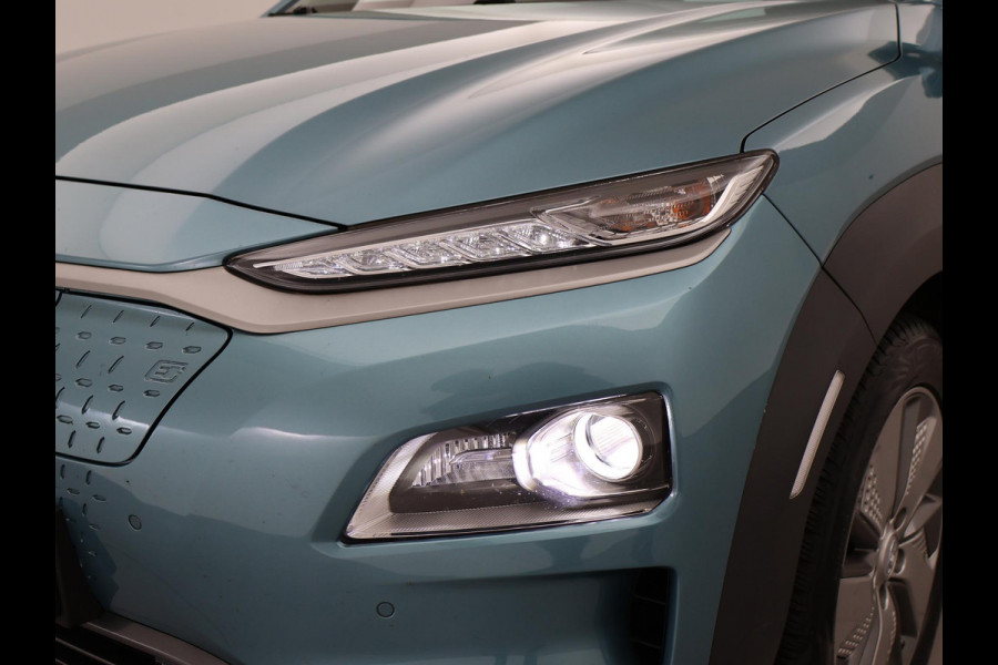 Hyundai Kona EV PREMIUM SKY 64 kWh 100% SOH *CERAMIC BLUE* + SCHUIFDAK | STOELVERW. V+A | STOELVENTILATIE | KRELL