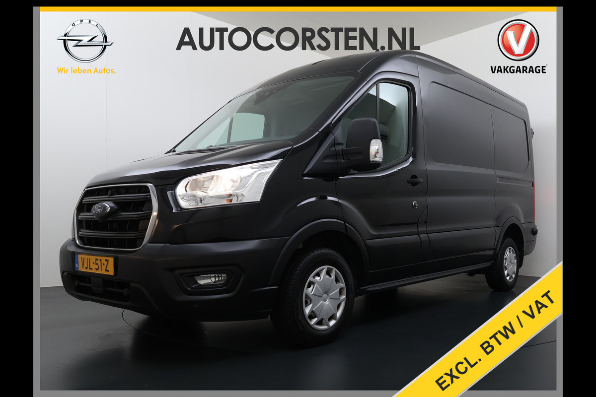Ford Transit 310 2.0 TDCI L2H2 3-Persoons Camera Airco Stoelverwarming Elek.Stoel Cruise Control Pdc Lane Assist Trend Betonplex Vloer Wandbetimmering Schuifdeur Voorruitverwarming 1e Eigenaar Origineel Nederlandse Bus