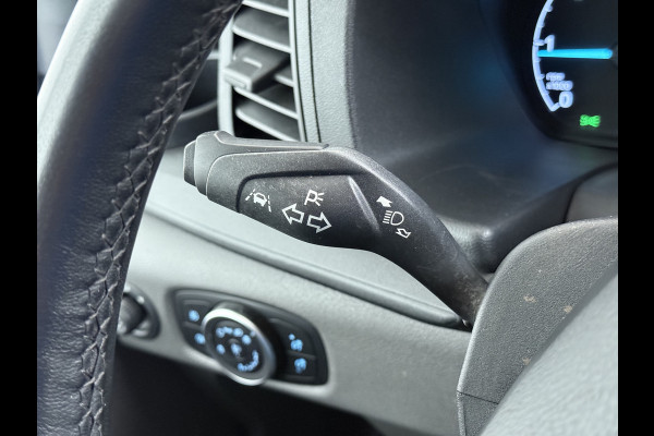 Ford Transit 310 2.0 TDCI L2H2 3-Persoons Camera Airco Stoelverwarming Elek.Stoel Cruise Control Pdc Lane Assist Trend Betonplex Vloer Wandbetimmering Schuifdeur Voorruitverwarming 1e Eigenaar Origineel Nederlandse Bus
