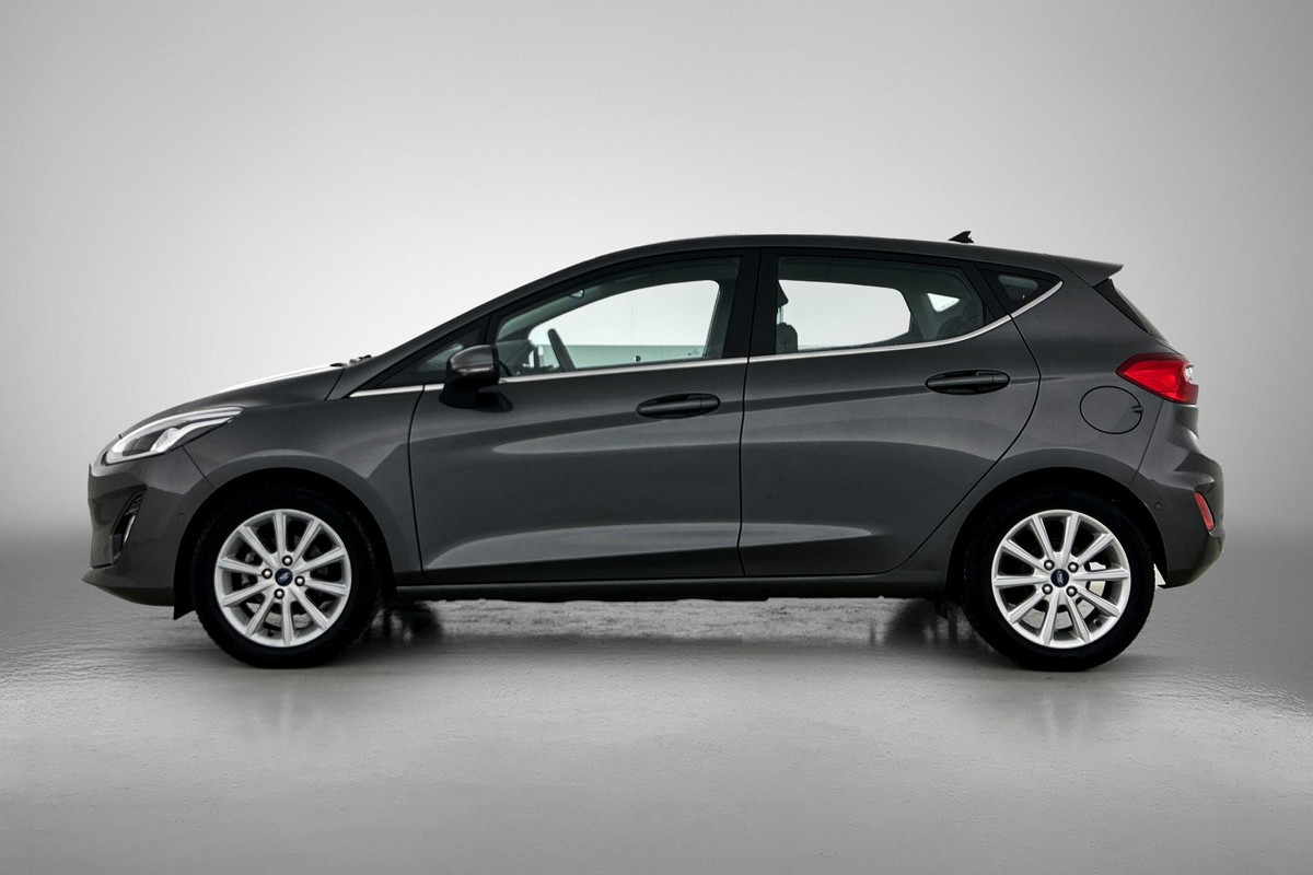 Ford Fiesta 1.0 EcoBoost Titanium (NAVIGATIE, CARPLAY, PARKEERSENSOREN, LED, STUURBEDIENING, 1e EIGENAAR, GOED ONDERHOUDEN)