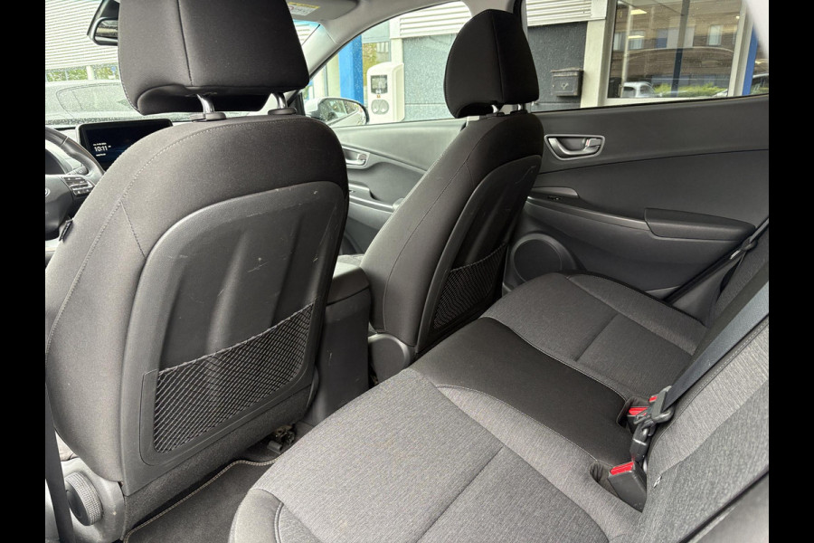 Hyundai Kona EV Fashion 64 kWh | 94,7% SOH | Trekhaak | Warmtepomp | Head-Up | 3Fase | Krell | Dodehoeksensoren | Camera |