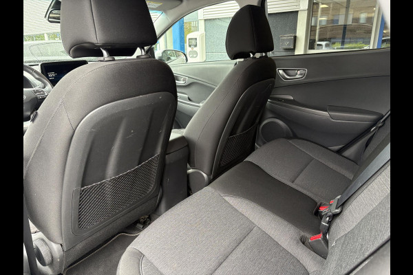 Hyundai Kona EV Fashion 64 kWh | 94,7% SOH | Trekhaak | Warmtepomp | Head-Up | 3Fase | Krell | Dodehoeksensoren | Camera |