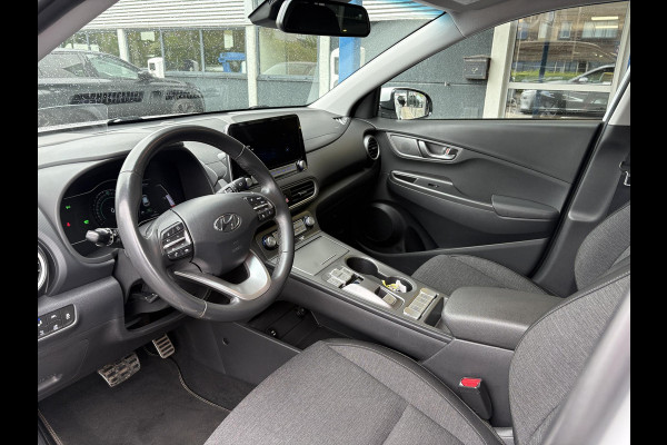 Hyundai Kona EV Fashion 64 kWh | 94,7% SOH | Trekhaak | Warmtepomp | Head-Up | 3Fase | Krell | Dodehoeksensoren | Camera |