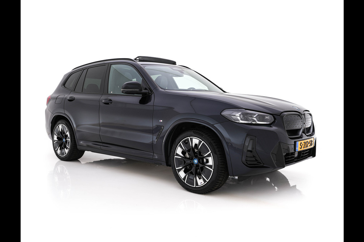 BMW iX3 High Executive 80 kWh Facelift [ 3-Fase-11kW) ] {SOH-100%} (INCL-BTW) Aut. *PANO | LEATHER | ADAPTIVE-CRUISE | FULL-LED | HARMAN/KARDON | TOPVIEW | MEMORY-PACK | BLINDSPOT | DIGI-COCKPIT | HEATED-COMFORTSEATS | DAB+ | NAVI-FULLMAP | HEAD-UP | 20''ALU