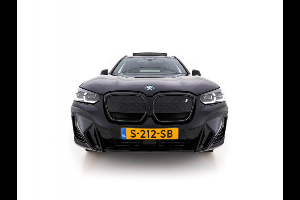 BMW iX3 High Executive 80 kWh Facelift [ 3-Fase-11kW) ] {SOH-100%} (INCL-BTW) Aut. *PANO | LEATHER | ADAPTIVE-CRUISE | FULL-LED | HARMAN/KARDON | TOPVIEW | MEMORY-PACK | BLINDSPOT | DIGI-COCKPIT | HEATED-COMFORTSEATS | DAB+ | NAVI-FULLMAP | HEAD-UP | 20''ALU
