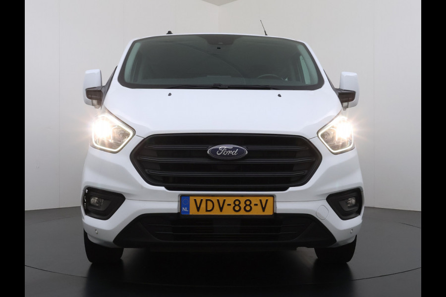 Ford Transit Custom 300 2.0TDCI 130PK Dubbele Cabine L2H1 Trekhaak Navi Camera Airco Cruise Control Pdc Trend DC Schuifdeur Betonplex Vloer Wandbetimmering Bott Inbouwkast Lane Assist 2.800KG Trekgewicht 1e Eigenaar