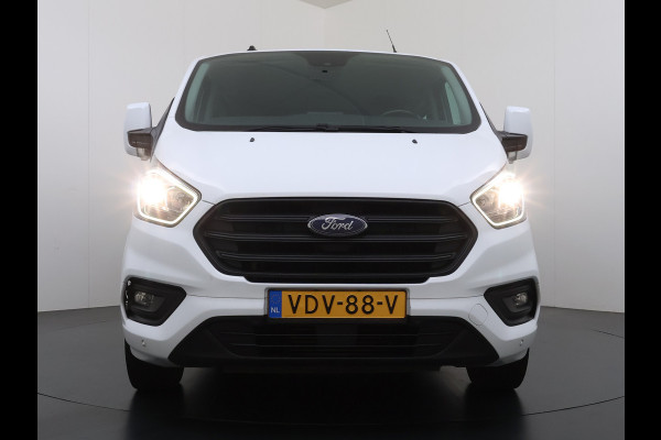 Ford Transit Custom 300 2.0TDCI 130PK Dubbele Cabine L2H1 Trekhaak Navi Camera Airco Cruise Control Pdc Trend DC Schuifdeur Betonplex Vloer Wandbetimmering Bott Inbouwkast Lane Assist 2.800KG Trekgewicht 1e Eigenaar