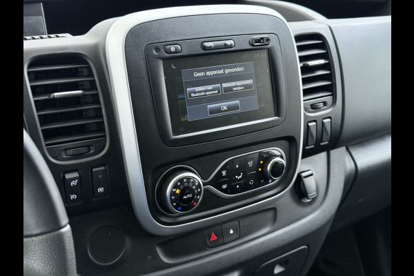 Renault Trafic 2.0 dCi 120 T29 L2H1 Dubbele Cabine Trekhaak Camera Navi Ecc Cruise Control Pdc DAB Business Euro 6 Betonplex Vloer Wandbetimmering Regen-Lichtsensor 2.000kg Trekgewicht 1e Eigenaar 5-Persoons