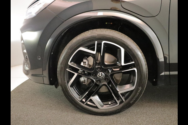 Volkswagen Tiguan 1.5 eHybrid R-Line Edition 272 pk Automaat (DSG) | Verlengde garantie | Navigatie | Panoramadak | Trekhaak (wegklapbaar) | Stoelverwarming v/a | Black Style pakket | R-Line |