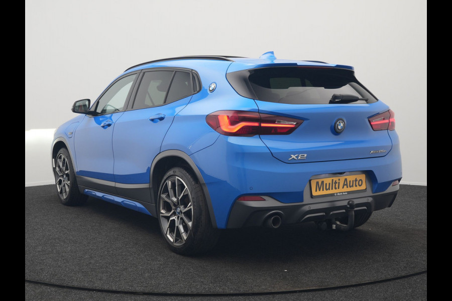 BMW X2 xDrive25e M Sport X PHEV 220pk Dealer O.H. | Trekhaak Afn. | Panodak | Adaptive Cruise | Head Up | Camera | Harman / Kardon | Lederen Competition Stoelen Memory & Verwarmd | Keyless | 19"L.M | Sfeerverlichting | Navigatie | DAB | Plug