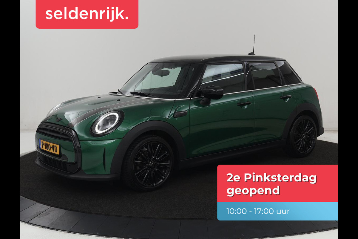 MINI Cooper 1.5 Business Edition | Harman/Kardon | Carplay | Verwarmde voorruit | Navigatie | Full LED | Half leder | Parkeerhulp | Climate control | Cruise control | Bluetooth | British Racing Green