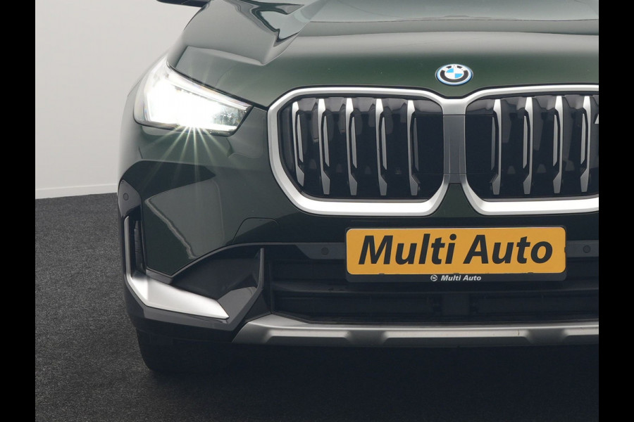 BMW iX1 xDrive30 xLine 67 kWh 306pk Dealer O.H. | Trekhaak Af Fabriek | Camera | Adaptief Onderstel | Lederen Sportstoelen Memory & Verwarmd | Sfeerverlichting | Apple Carplay | Blis | Navigatie | DAB | Virtual | Cruise Control |