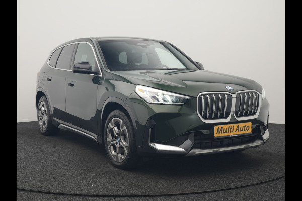 BMW iX1 xDrive30 xLine 67 kWh 306pk Dealer O.H. | Trekhaak Af Fabriek | Camera | Adaptief Onderstel | Lederen Sportstoelen Memory & Verwarmd | Sfeerverlichting | Apple Carplay | Blis | Navigatie | DAB | Virtual | Cruise Control |