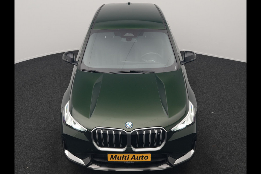 BMW iX1 xDrive30 xLine 67 kWh 306pk Dealer O.H. | Trekhaak Af Fabriek | Camera | Adaptief Onderstel | Lederen Sportstoelen Memory & Verwarmd | Sfeerverlichting | Apple Carplay | Blis | Navigatie | DAB | Virtual | Cruise Control |