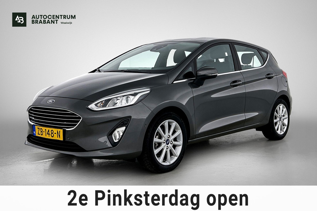 Ford Fiesta 1.0 EcoBoost Titanium (NAVIGATIE, CARPLAY, PARKEERSENSOREN, LED, STUURBEDIENING, 1e EIGENAAR, GOED ONDERHOUDEN)
