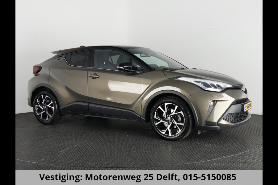 Toyota C-HR 1.8 HYBRID BI-TONE LUXERY LINE GARANTIE 5-2032 TREKHAAK. 4 SEIZOENEN BANDEN.NAVIGATIE. STUUR EN STOELVERWARMING. HALF LEDER