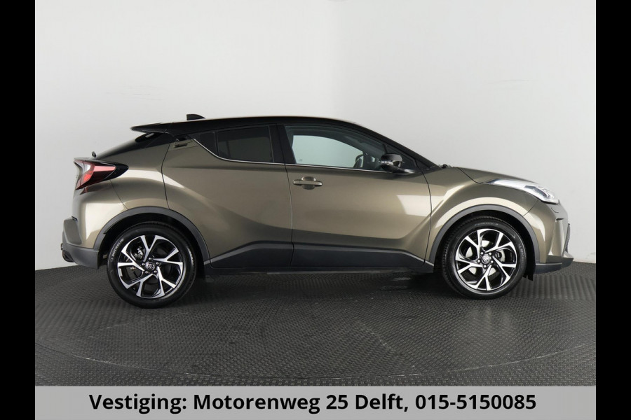 Toyota C-HR 1.8 HYBRID BI-TONE LUXERY LINE GARANTIE 5-2032 TREKHAAK. 4 SEIZOENEN BANDEN.NAVIGATIE. STUUR EN STOELVERWARMING. HALF LEDER