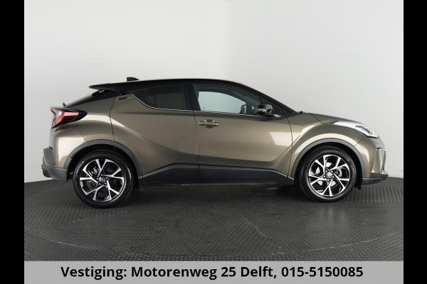 Toyota C-HR 1.8 HYBRID BI-TONE LUXERY LINE GARANTIE 5-2032 TREKHAAK. 4 SEIZOENEN BANDEN.NAVIGATIE. STUUR EN STOELVERWARMING. HALF LEDER