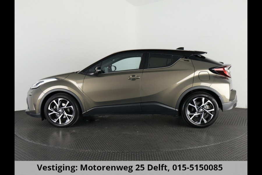 Toyota C-HR 1.8 HYBRID BI-TONE LUXERY LINE GARANTIE 5-2032 TREKHAAK. 4 SEIZOENEN BANDEN.NAVIGATIE. STUUR EN STOELVERWARMING. HALF LEDER