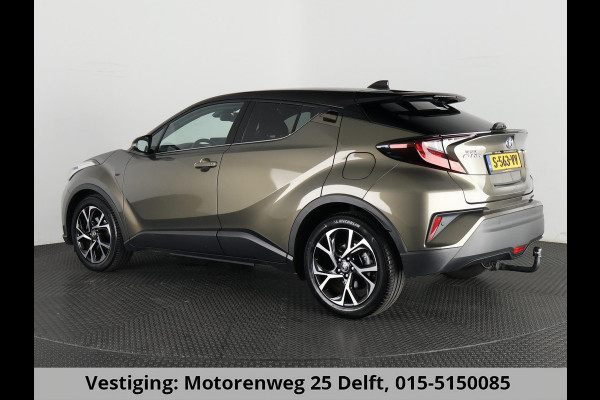 Toyota C-HR 1.8 HYBRID BI-TONE LUXERY LINE GARANTIE 5-2032 TREKHAAK. 4 SEIZOENEN BANDEN.NAVIGATIE. STUUR EN STOELVERWARMING. HALF LEDER