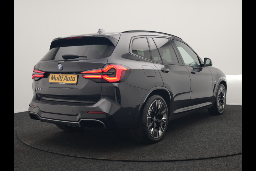 BMW iX3 M Sport 80 kWh 286pk Dealer O.H. | Trekhaak Af Fabriek | Panodak | Head Up | Adaptive Cruise | 360 Camera | Harman / Kardon | Lederen Sportstoelen Memory & Verwarmd | Laser LED | Stuur Verwarmd | Keyless | Blis | Sfeerverlichting | 20"L.M |