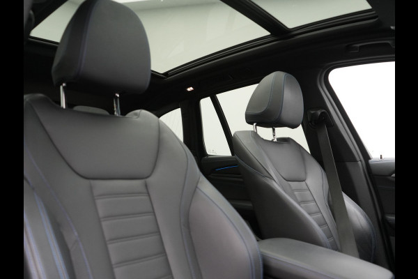 BMW iX3 M Sport 80 kWh 286pk Dealer O.H. | Trekhaak Af Fabriek | Panodak | Head Up | Adaptive Cruise | 360 Camera | Harman / Kardon | Lederen Sportstoelen Memory & Verwarmd | Laser LED | Stuur Verwarmd | Keyless | Blis | Sfeerverlichting | 20"L.M |