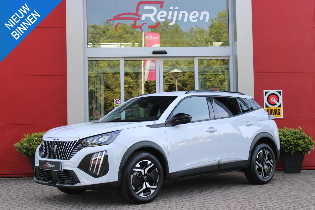Peugeot 2008 1.2 Hybrid 145PK AUTOMAAT ALLURE | NAVIGATIE | KEYLESS ENTRY/START | DRAADLOZE TELEFOONLADER | DRAADLOZE APPLE CARPLAY/ANDROID AUTO | CAMERA VOOR + ACHTER | PARKEERSENSOREN VOOR + ACHTER | LICHTMETALEN VELGEN 17" | CLIMATE CONTROL | ADAPTIVE CRUISE CONTROL | DODEHOEK DETECTIE |