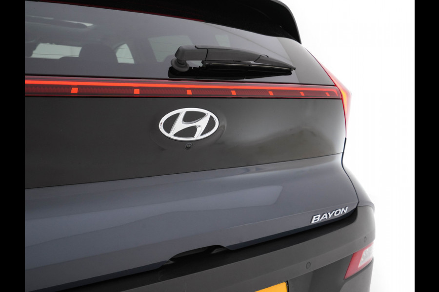 Hyundai Bayon 1.0 T-GDI Premium Sky MHEV (INCL-BTW) *PANO | ADAPTIVE-CRUISE | FULL-LED | BOSE-SOUND | BLINDSPOT | DIGI-COCKPIT | HEATED-SPORTSEATS | CAMERA | DAB | KEYLESS | PRIVACYGLASS | TOWBAR | 16''ALU*