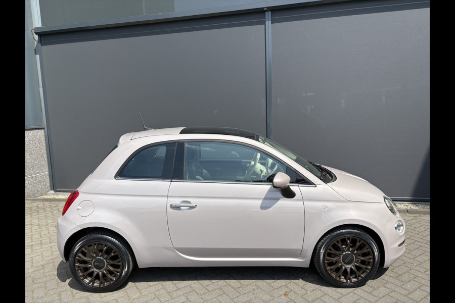 Fiat 500 1.2 Star Powder Pink Glazen panoramadak - Climate control - Parkeersensor achter - Cruise control - Mistlampen - Licht metalen velgen 16 inch - Bluetooth - Radio - Stuur multifunctioneel - Elektrische ramen - Lederen bekleding -  Extra getint glas achter