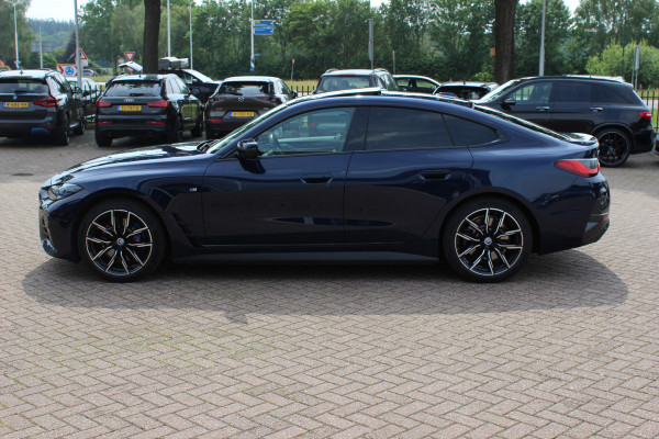 BMW i4 eDrive40 High Exe. M Sportpakket 84 kWh / SOH 91,4% / Trekhaak / Schuifdak / 360Camera / Head-up / Leder / Harman Kardon / Keyless / 19'' / Sfeerverlichting / CarPlay / Stoelventilatie+Verwarming / DAB / ACC