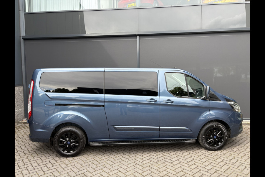 Ford Transit Custom 320 2.0 TDCI L2H1 Platinum Edition DC Automaat Achteruitrijcamera - Parkeersensoren - Navigatie - Airco - Dodehoek detector - Cruise control - Licht metalen velgen 16 inch - Lederen bekleding - Radio - Bluetooth - Dubbele cabine - Tussens - Mistlampen voor - Sidebars - Trekhaak - Voorstoelen verwarmd - Led verlichting - Extra getint glas achter - Start/stop systeem - Stuur multifunctioneel - Stuur leder - Regensensor