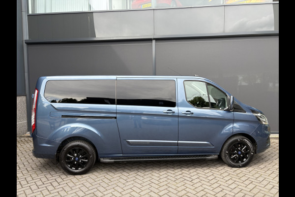 Ford Transit Custom 320 2.0 TDCI L2H1 Platinum Edition DC Automaat Achteruitrijcamera - Parkeersensoren - Navigatie - Airco - Dodehoek detector - Cruise control - Licht metalen velgen 16 inch - Lederen bekleding - Radio - Bluetooth - Dubbele cabine - Tussens - Mistlampen voor - Sidebars - Trekhaak - Voorstoelen verwarmd - Led verlichting - Extra getint glas achter - Start/stop systeem - Stuur multifunctioneel - Stuur leder - Regensensor